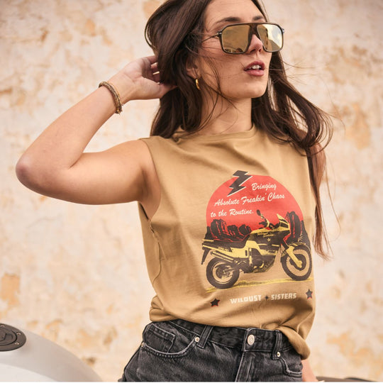 Wildust Sisters Take a Trip tank top close-up women’s lifestyle image with motorcycle graphic and retro summer styling
