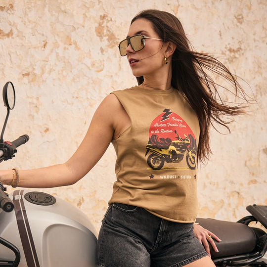 Wildust Sisters Take a Trip tank top women’s lifestyle image with motorcycle graphic and summer riding style