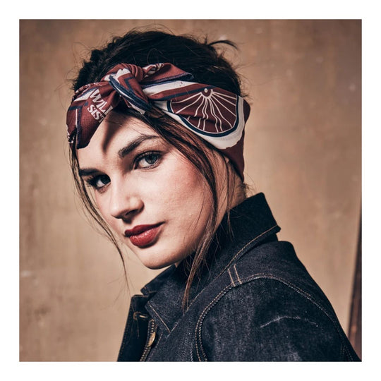 Wildust Sisters Victory motorcycle scarf brown graphic print worn headscarf lifestyle portrait image