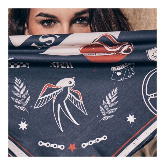 Wildust Sisters Victory motorcycle scarf blue graphic print worn face covering close up lifestyle image