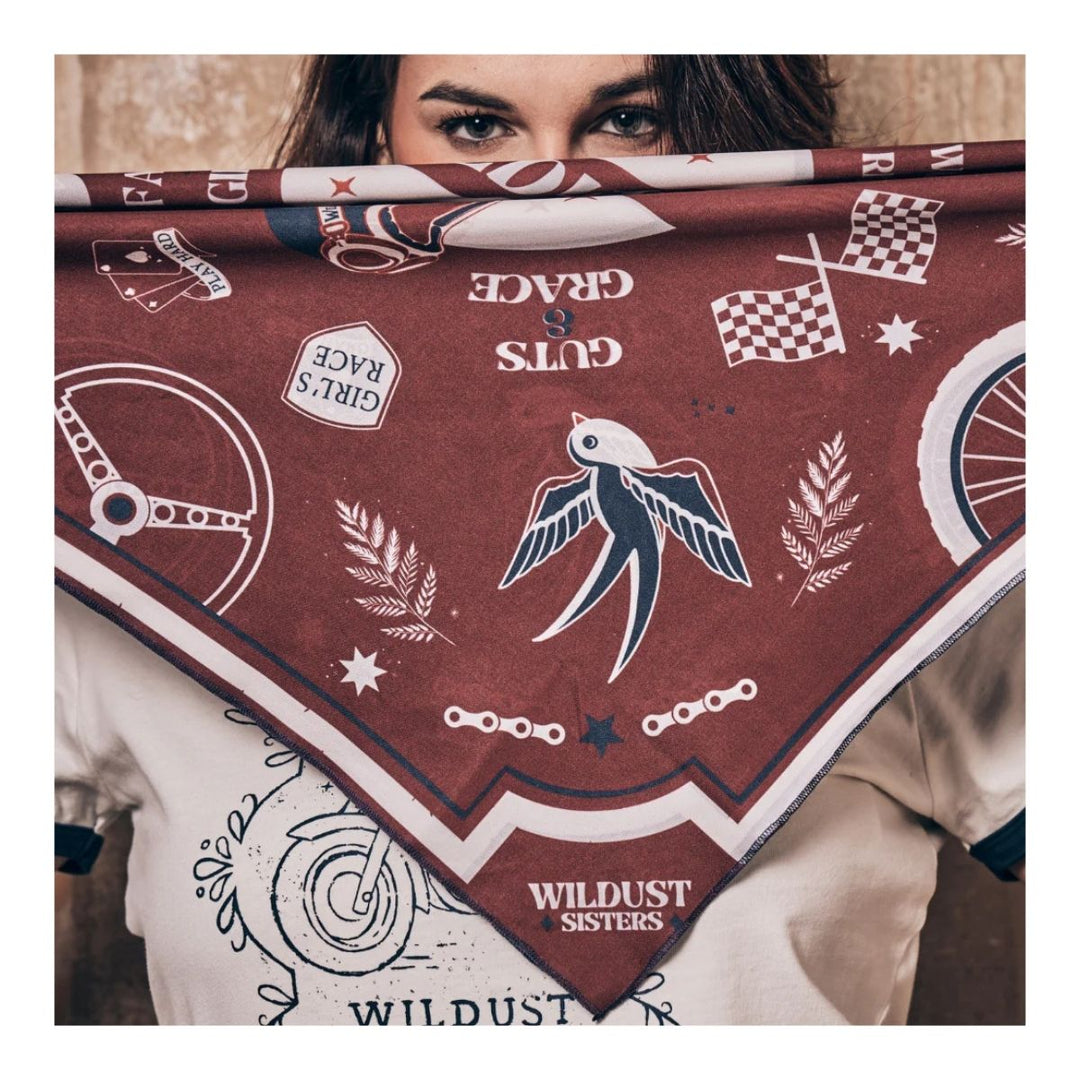 Wildust Sisters Victory motorcycle scarf brown graphic print worn face covering lifestyle image