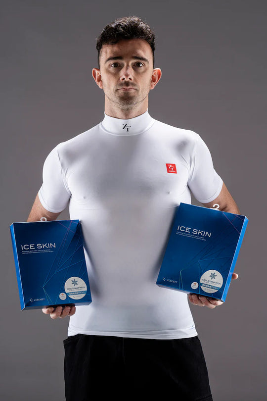 Zerofit IceSkin short sleeve base layer in white worn by model holding product packaging